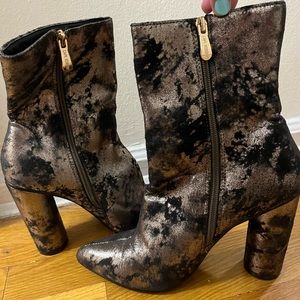 Cowboy style pointed toe silver and back bootie heels